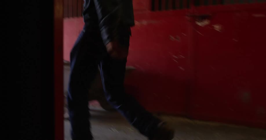 An angry man kicking a cardboard box