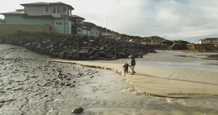 People play along the shore below