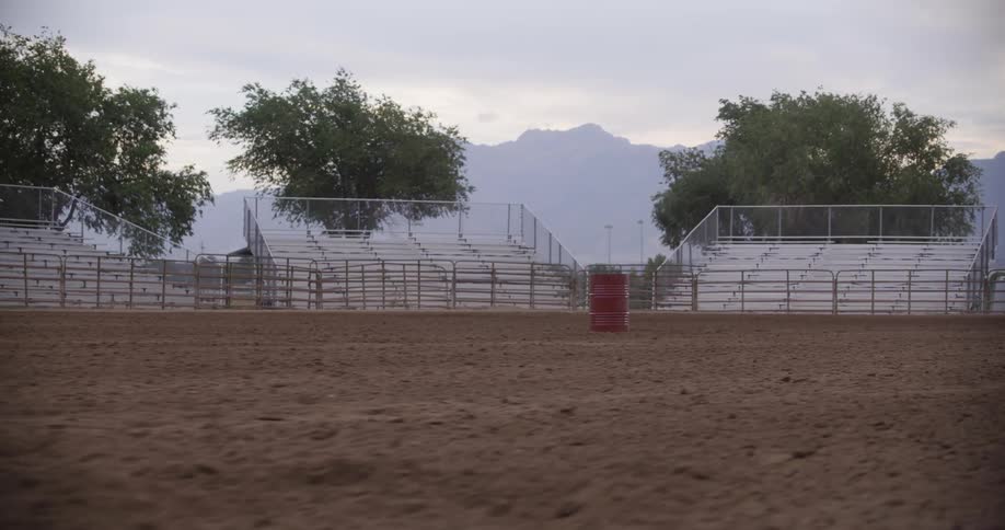 View of a sandy rodeo stadium arena