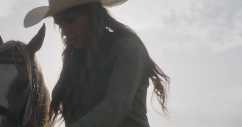 A woman walking beside her horse