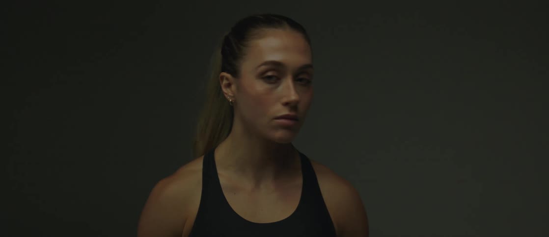 A woman turning her head from side to side