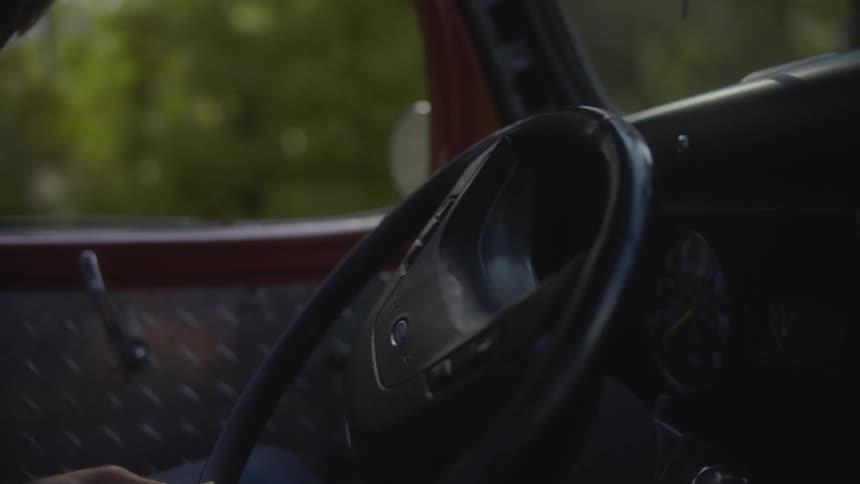 Man starting his work truck  and driving away