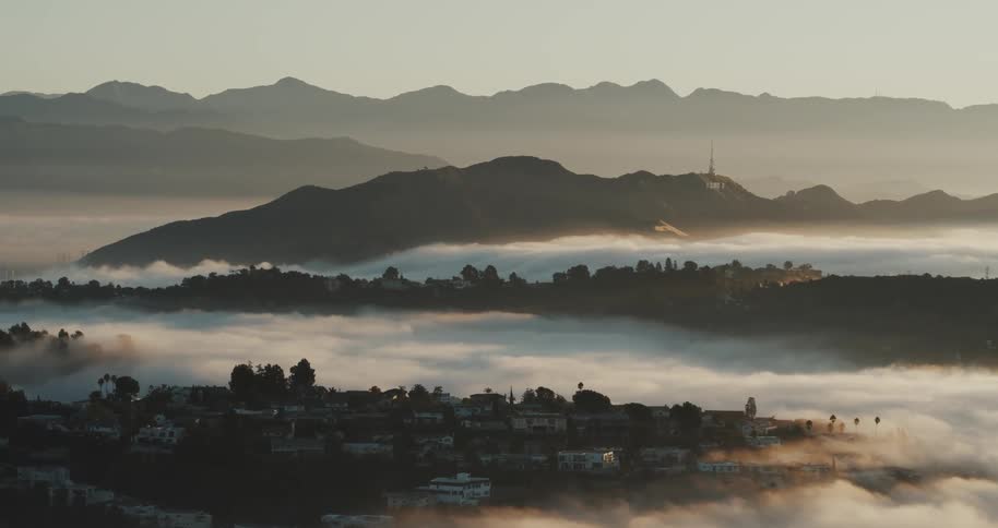 An aerial establishing shot of Los Angeles neighborhoods at dawn