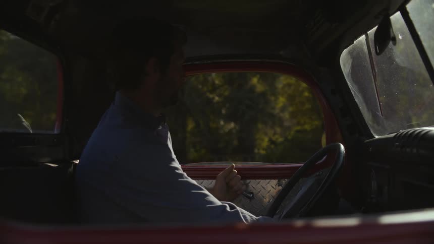 Man opening the door and getting out of his truck