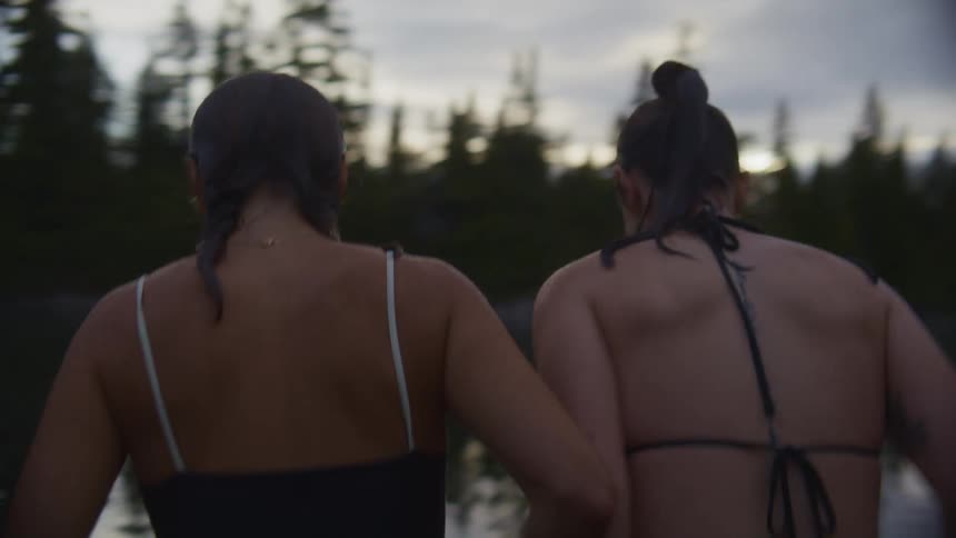Group of teen jumping into a lake