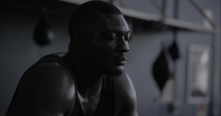 A man is relaxing in a gym