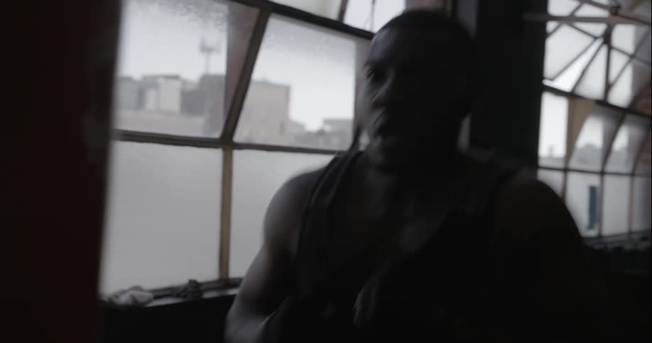 A man is punching a punching bag