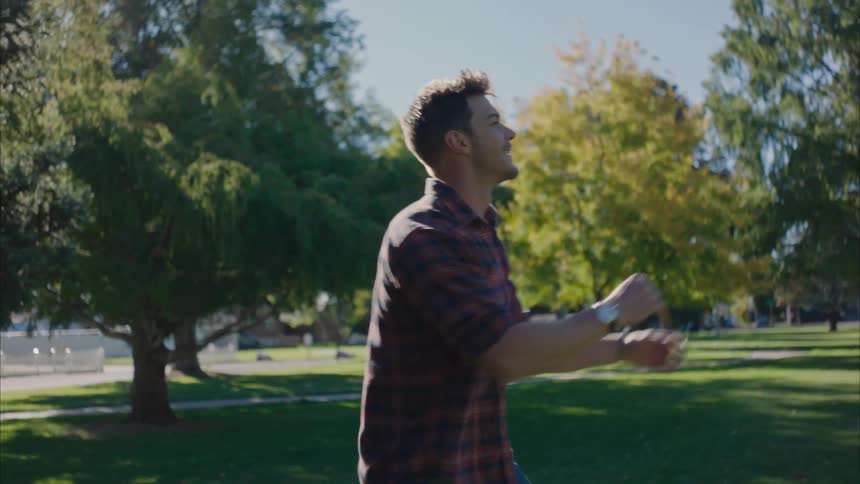 Man playing football on a park at morning