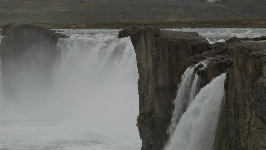 A large waterfall has many areas of water pouring down