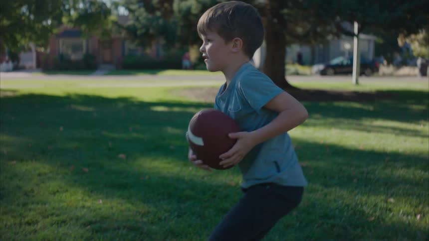 A clip of a father and son playing american football