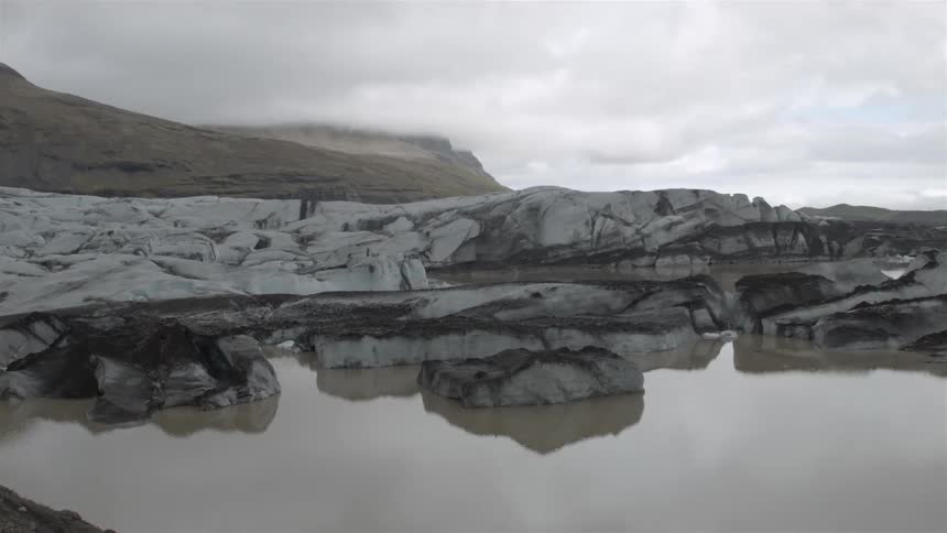 Still water and rock formations