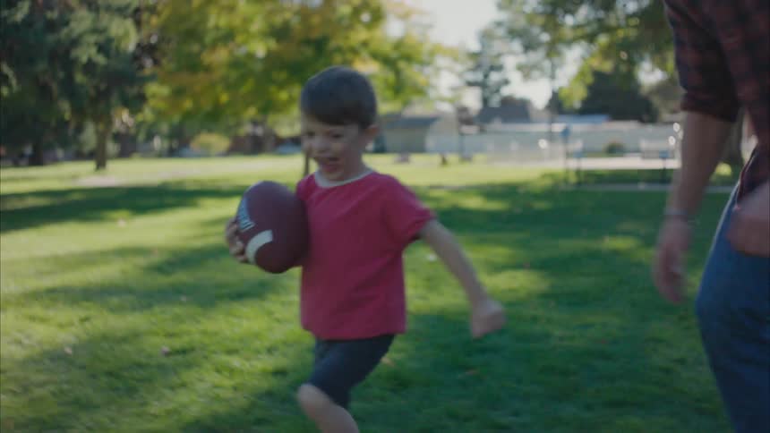 A clip of a young kid and his father playing
