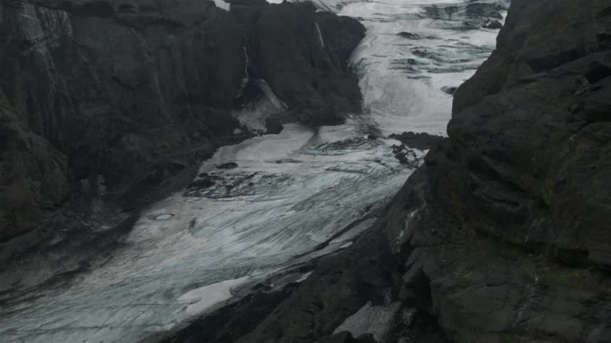 A dried up river between two rock formations