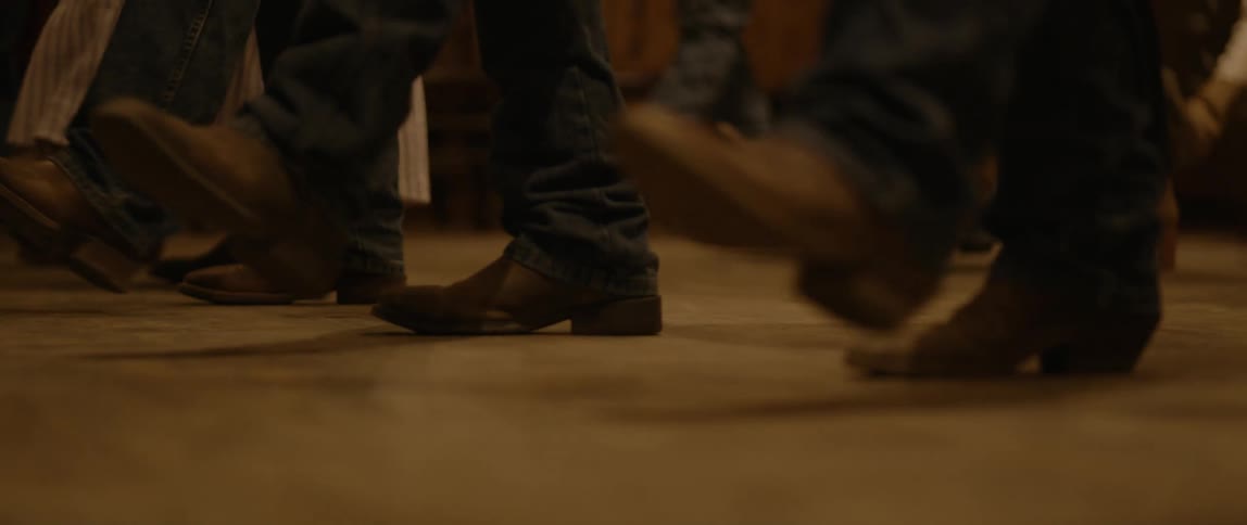 People are square dancing in a line