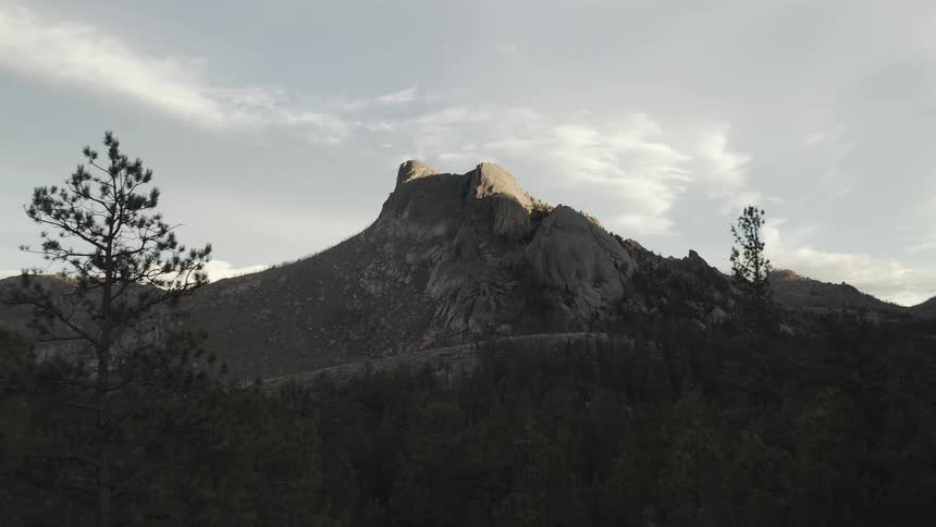 Sunlight touches the top of a mountain at morning