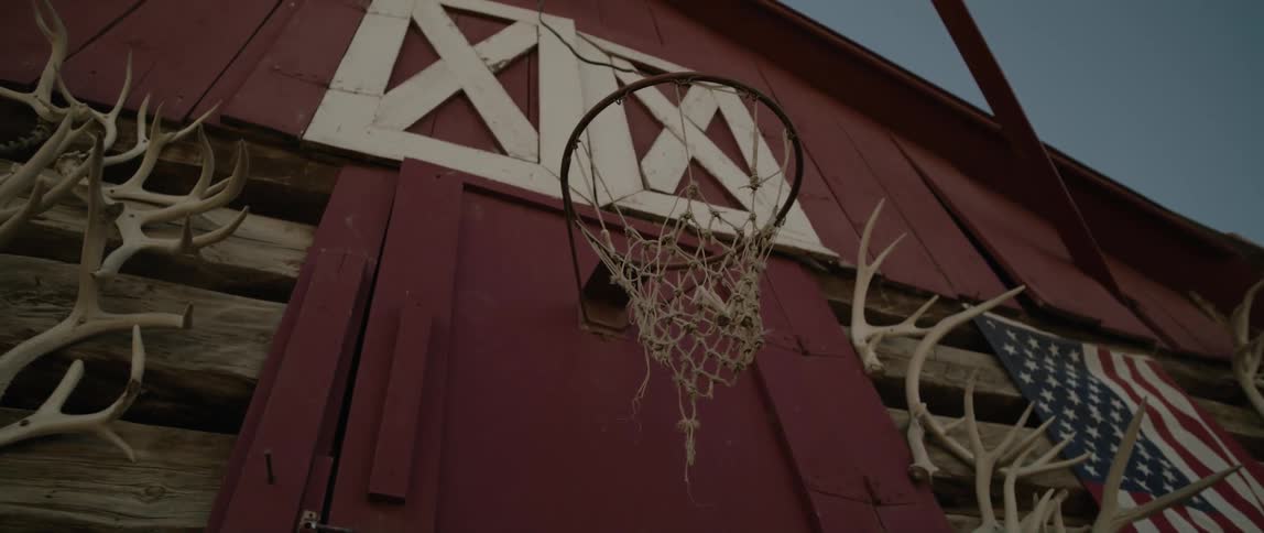 Basketball hoop in a wooden barn