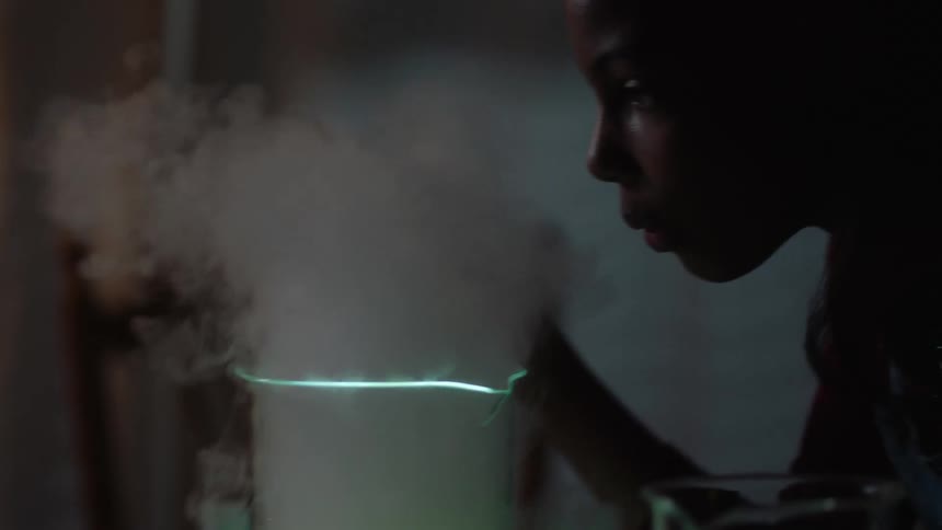 Girl plays with an experiment a home