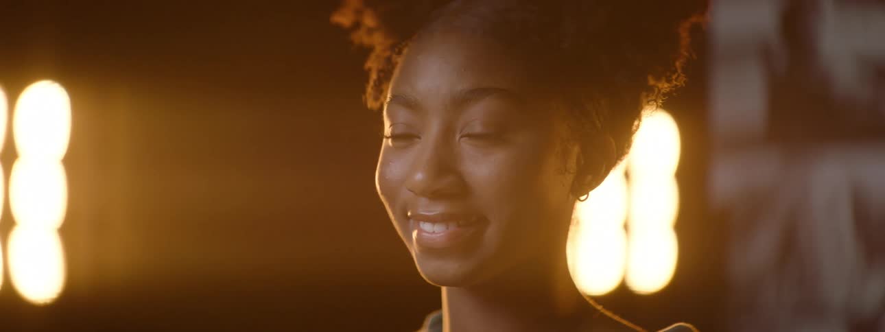 A young girl with a beautiful smile on her lips