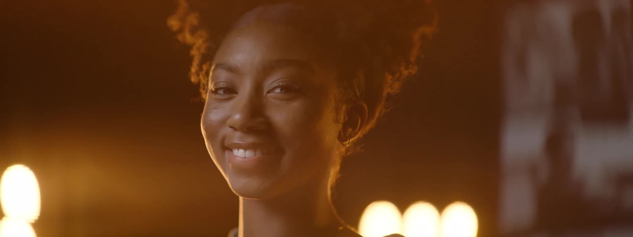 Young girl on a stage smile at the camera