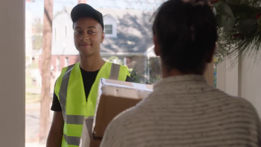 A delivery man delivering the customers orders