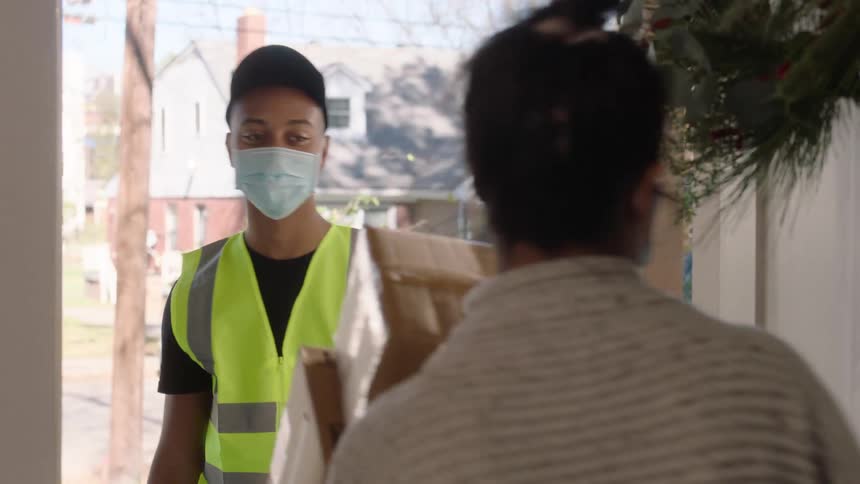 Woman receives a package at the door