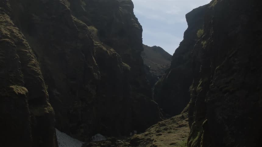 Birds fly around this stone valley