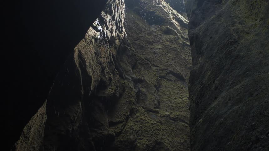 Rain falling into a crack in a canyon