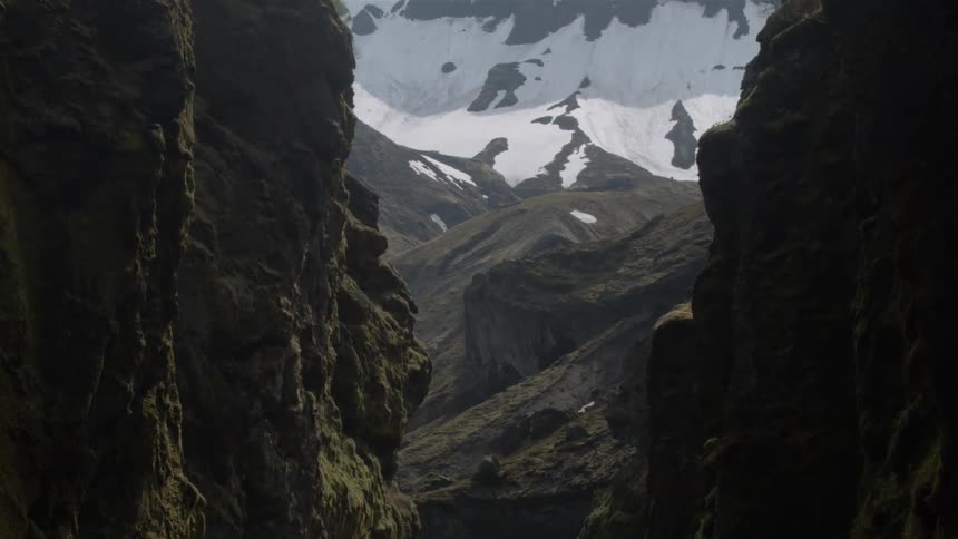 View of a cavern and snowy mountain