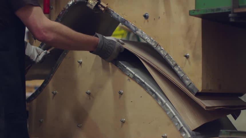 Laminated material being placed and pressed inside a sheet