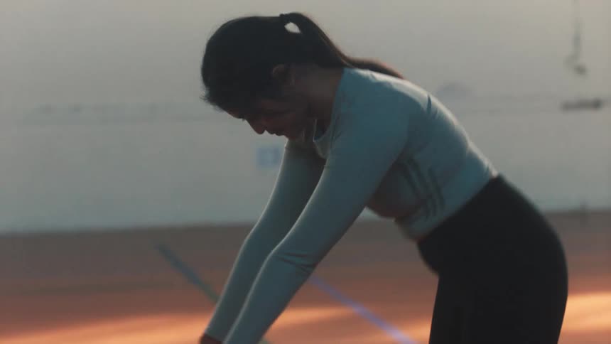 Ballet dancers in a group practicing graceful movements in a ballet rehearsal