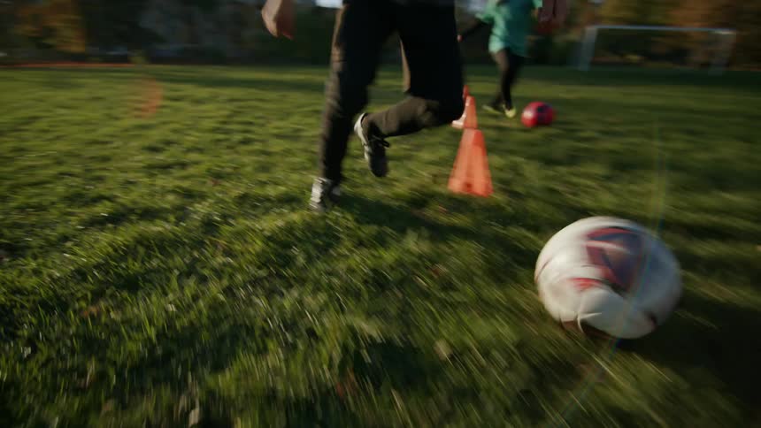 A clip of kids playing fooball on the field