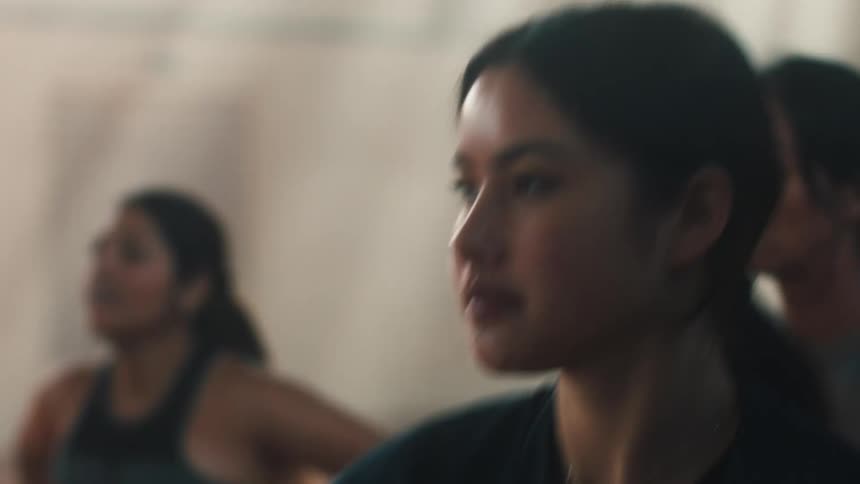 Portrait of women indoors jumping and doing cardio exercises