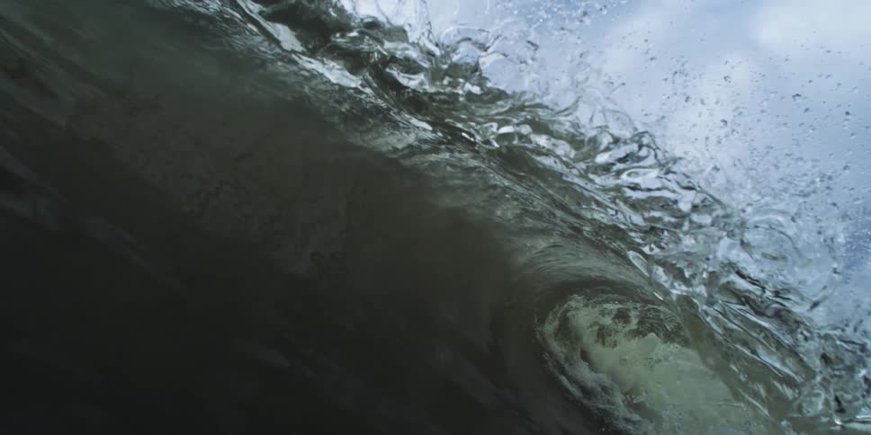 Slowmotion view of a sea wave breaking