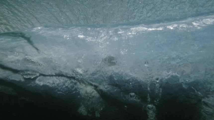 Sea waves with bubbles in the water