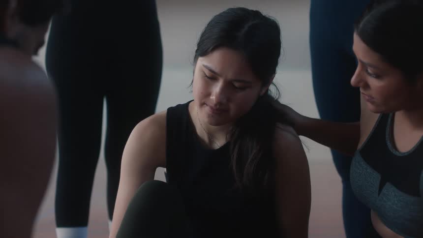 A dancer sad because she got hurt dancing