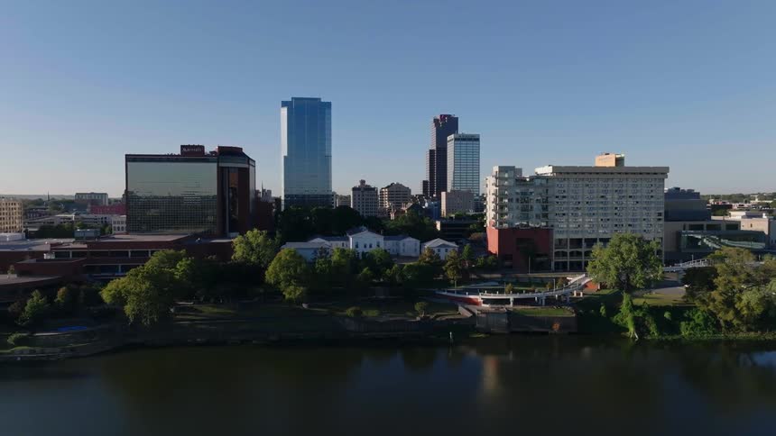 Aerial of the city near the park with lagoon during the day