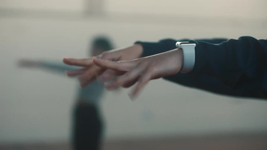Closeup on a womans hands raising and lowering her fingers