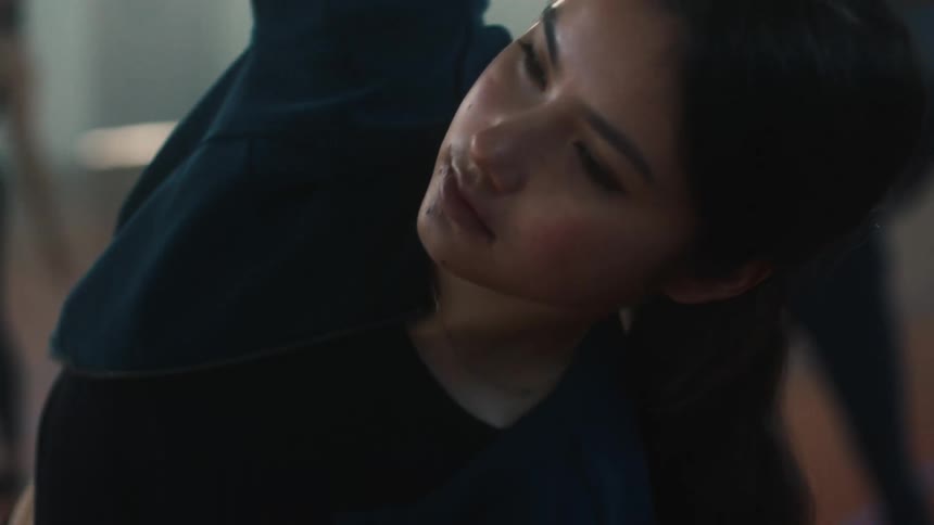 Portrait of a young woman stretching her body
