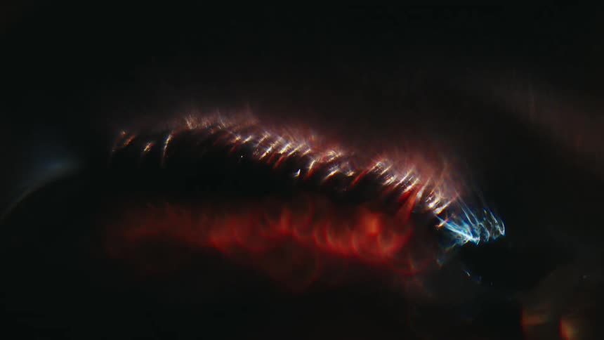 Blue flame plays over glowing metal rings