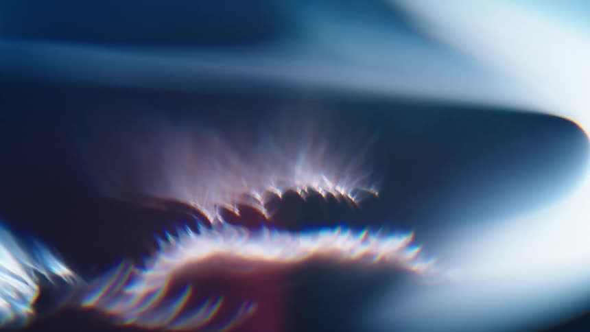 Abstract art of fire and white rays in the dark night