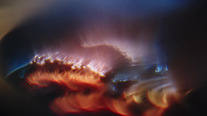 Bright light gleams off of the surface of a metallic tool
