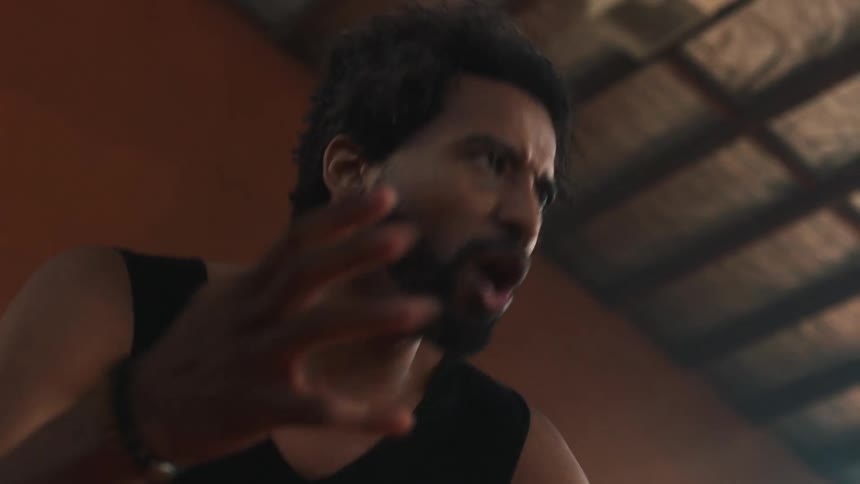 Portrait of a man doing cardio and conversing with others