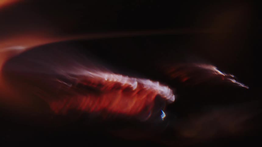 Extreme closeup of an abstract object with reflections of lights