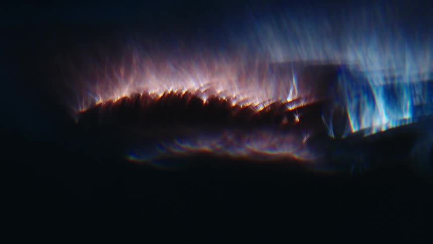 Extreme closeup on dark lights with reflections