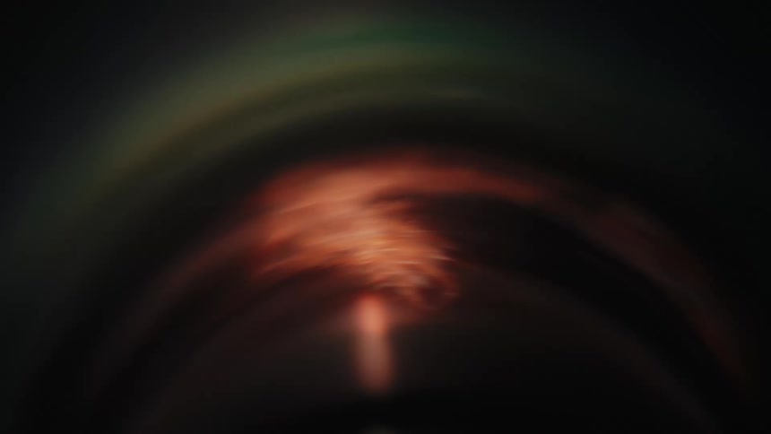 A metallic device with braided copper fiber on it spins quickly