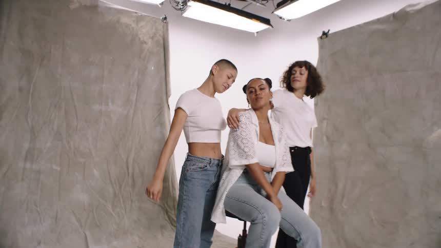 Smiling women at a photo shoot in a studio