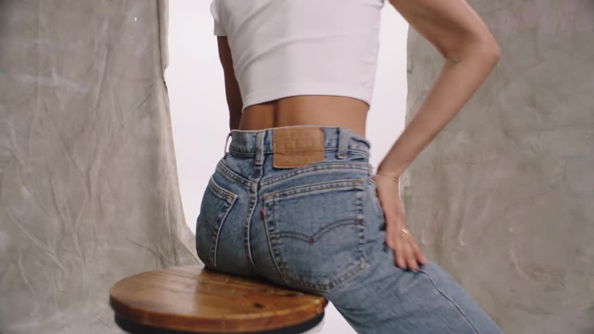 A woman in a denim clothing photoshoot