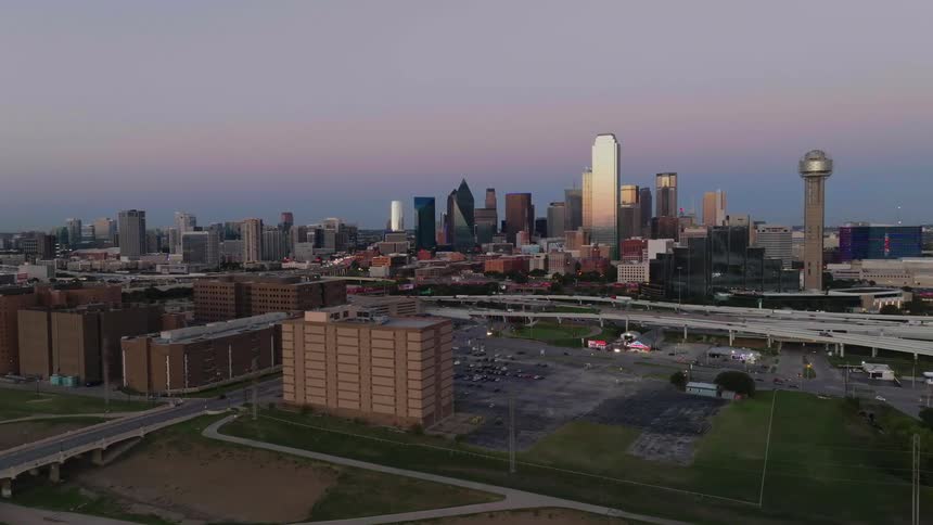 Aerial view of a highway bridge and the sky scrapers in the downtown area of a city