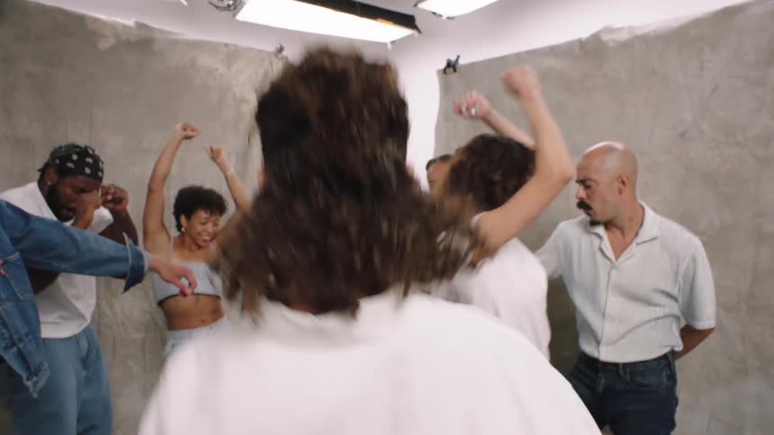 Group of happy people have fun dancing in a studio