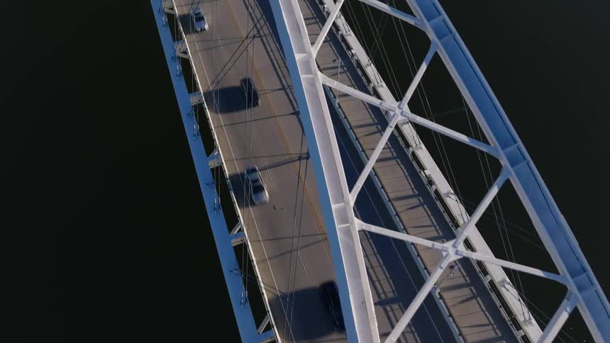 Aerial of the road bridge over the river during the day